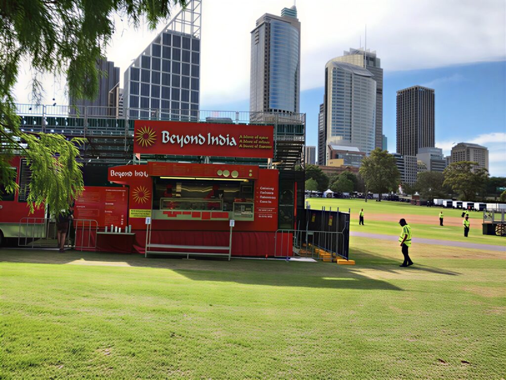 Beyond India food stall at Adelaide Oval with city skyline backdrop serving authentic Indian cuisine at outdoor events