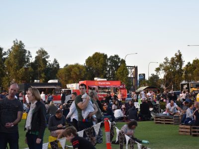 Beyond India food truck at Adelaide event, crowd enjoying delicious eats.